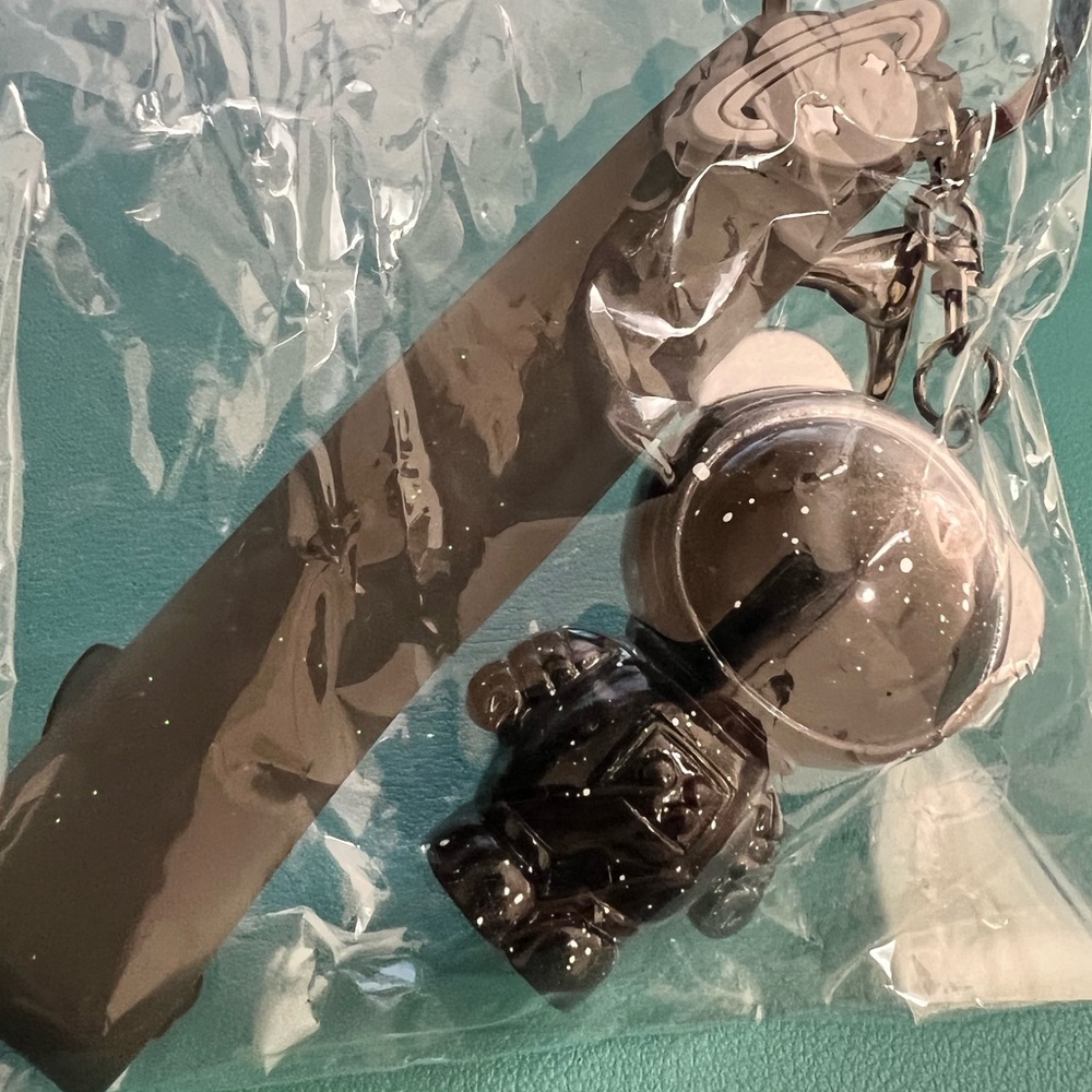 An astronaut keychain with strap